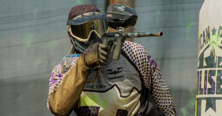 player-shoots-paintball-gun